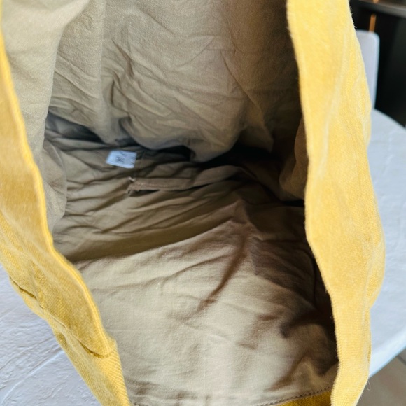 Tannish yellow fold over backpack made -heavy duty fabric, tan suede accents - Picture 2 of 4